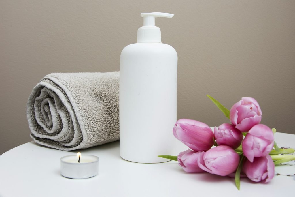 Fresh towels, flowers, and spa essentials prepared for a relaxing home session